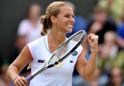 Slovak player Dominika Cibulkova reacts after beating German player Julia Goerges during the women's single at the Wimbledon Tennis Championships at the All England Tennis Club, in southwest London on June 25, 2011.AFP PHOTO / BEN STANSALL