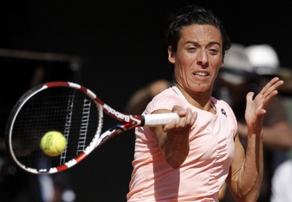 Italia's Francesca Schiavone hits a return to France's Marion Bartoli during their Women's semi final match in the French Open tennis championship at the Roland Garros stadium, on June 2, 2011 in Paris. AFP PHOTO / THOMAS COEX 