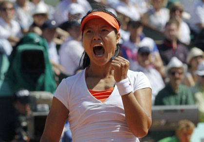 Li Na celebrates during a match at the 2011 French Open. 