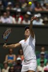 SM 2010 Wimbledon Justine Henin serve high