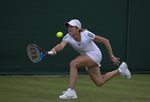 2010 Wimbledon Justine Henin bent reach