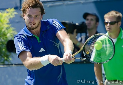 Ernests Gulbis of Latvia hits a backhand during the 2011 Farmers Classic in Los Angeles. Photo Credit: Tony Chang