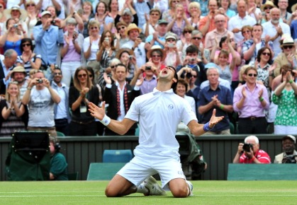 Serbian player Novak Djokovic reacts after beating French player Jo-Wilfried Tsonga during the men's single semi final at the Wimbledon Tennis Championships at the All England Tennis Club, in southwest London on July 1, 2011.