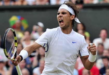 Spanish player Rafael Nadal celebrates winning the third set against Argentina's Juan Martin Del Potro in a Men's Singles match at the 2011 Wimbledon Tennis Championships at the All England Tennis Club, in south-west London, on June 27, 2011. 
