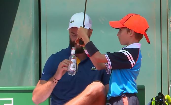 Watch: Paire Needs Two Ballkids to Block the Sun  